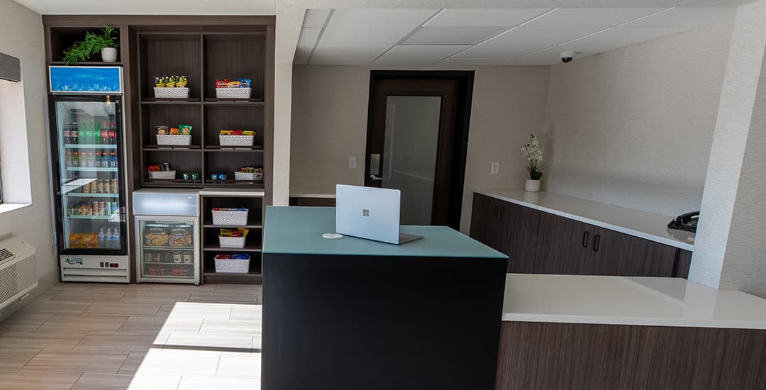 Front desk area of Superior Stay Hotel in Marquette